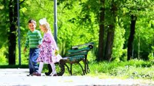 boy and girl and bench
